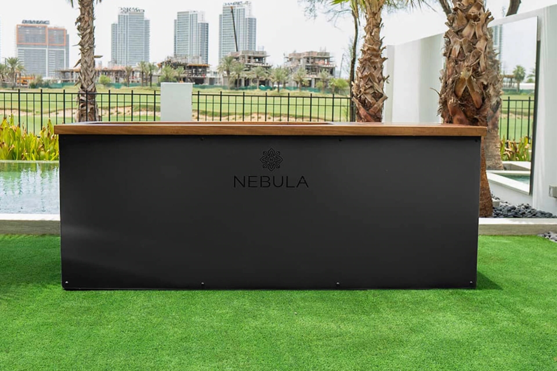 Black Nebula ice bath with timber trim in an outdoor setting