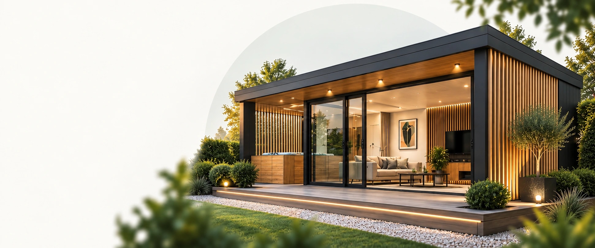 Garden room concept with oak cladding, a glazed lounge and sheltered hot tub opening onto an illuminated timber deck