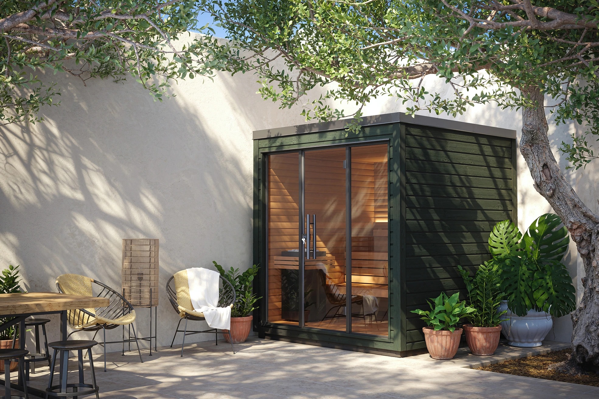 Green Mira L sauna with a glass front in a landscaped courtyard
