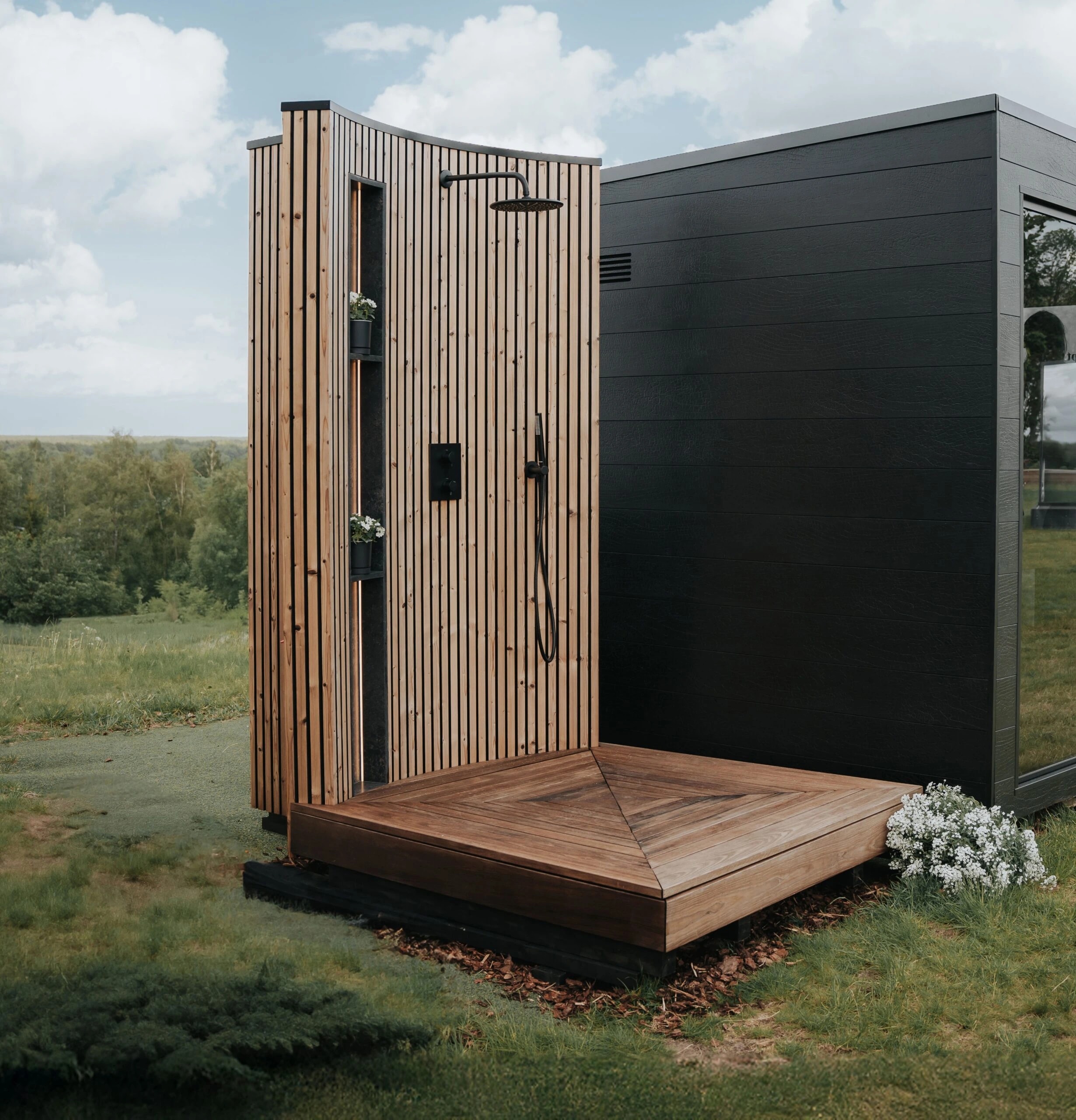 VelAqua outdoor shower with vertical timber cladding, black fittings and a timber base